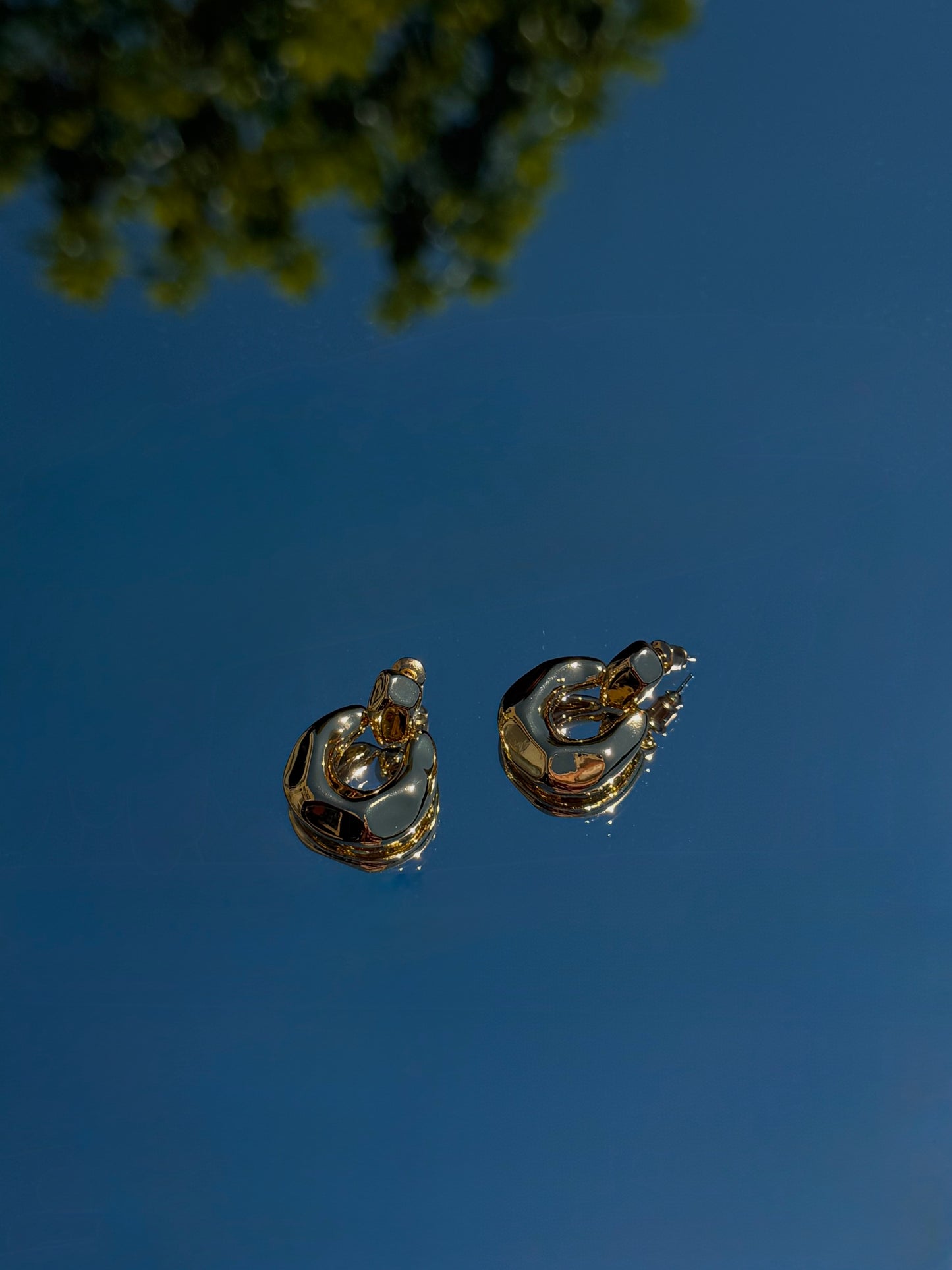 Dented hoop earring